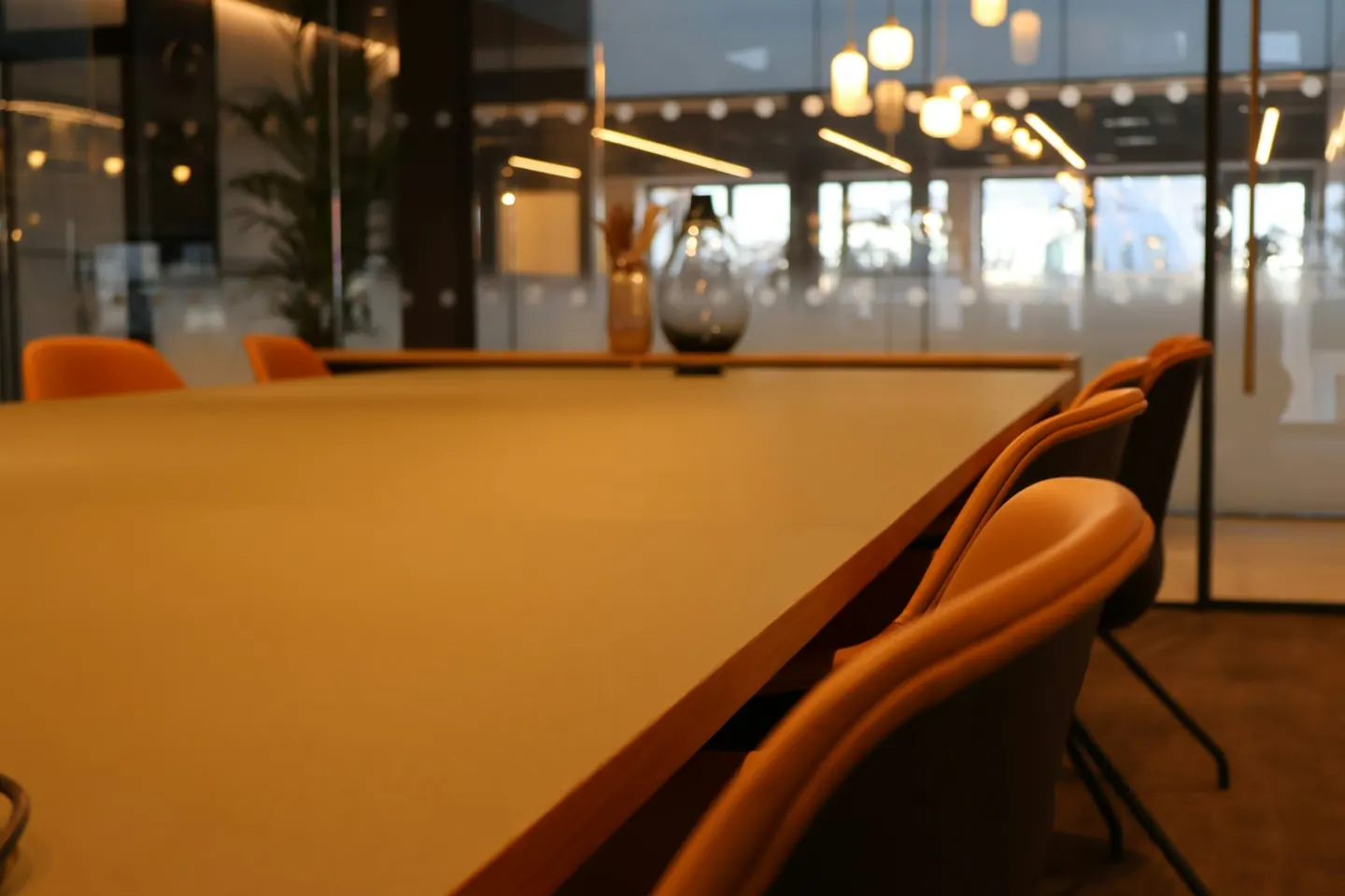 A conference room with a large table and chairs