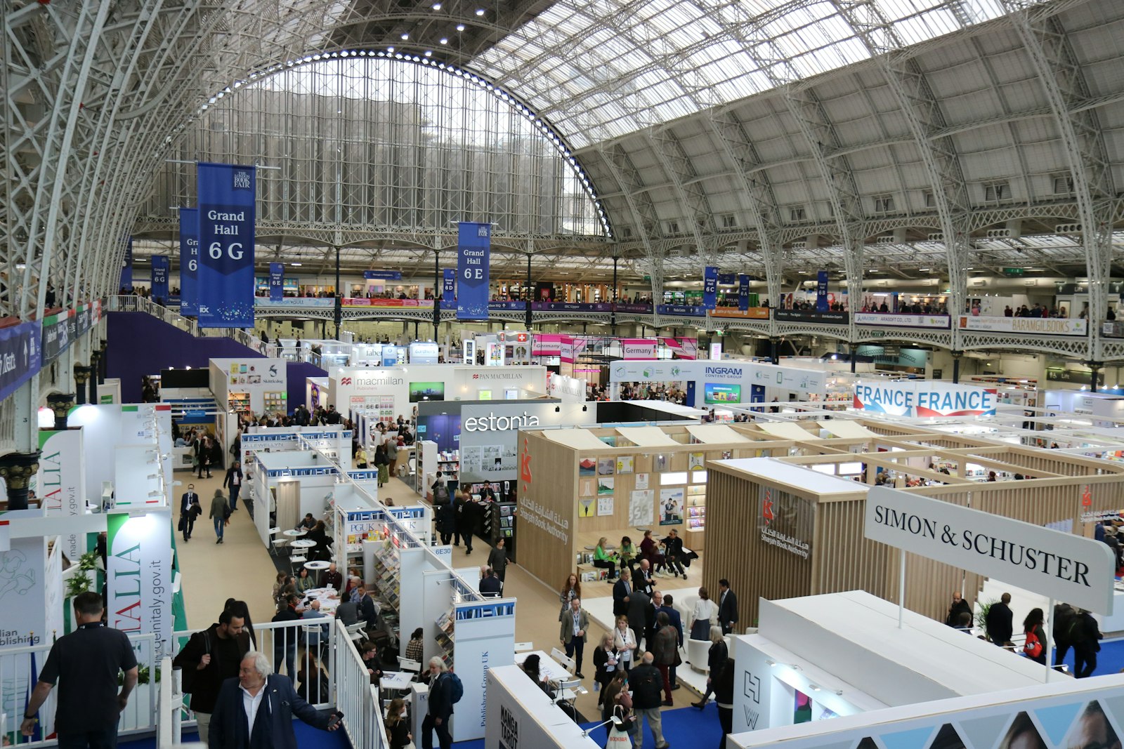 Busy exhibition hall with many booths and attendees