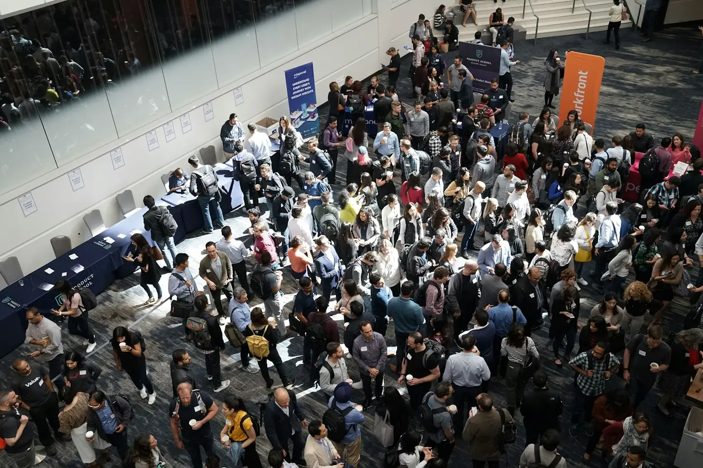 Crowd of people in a building lobby