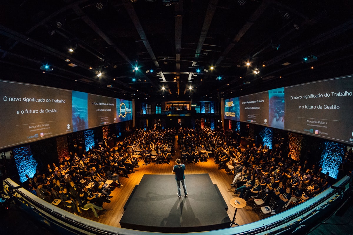 Keynote speaker on stage in front of a large audience