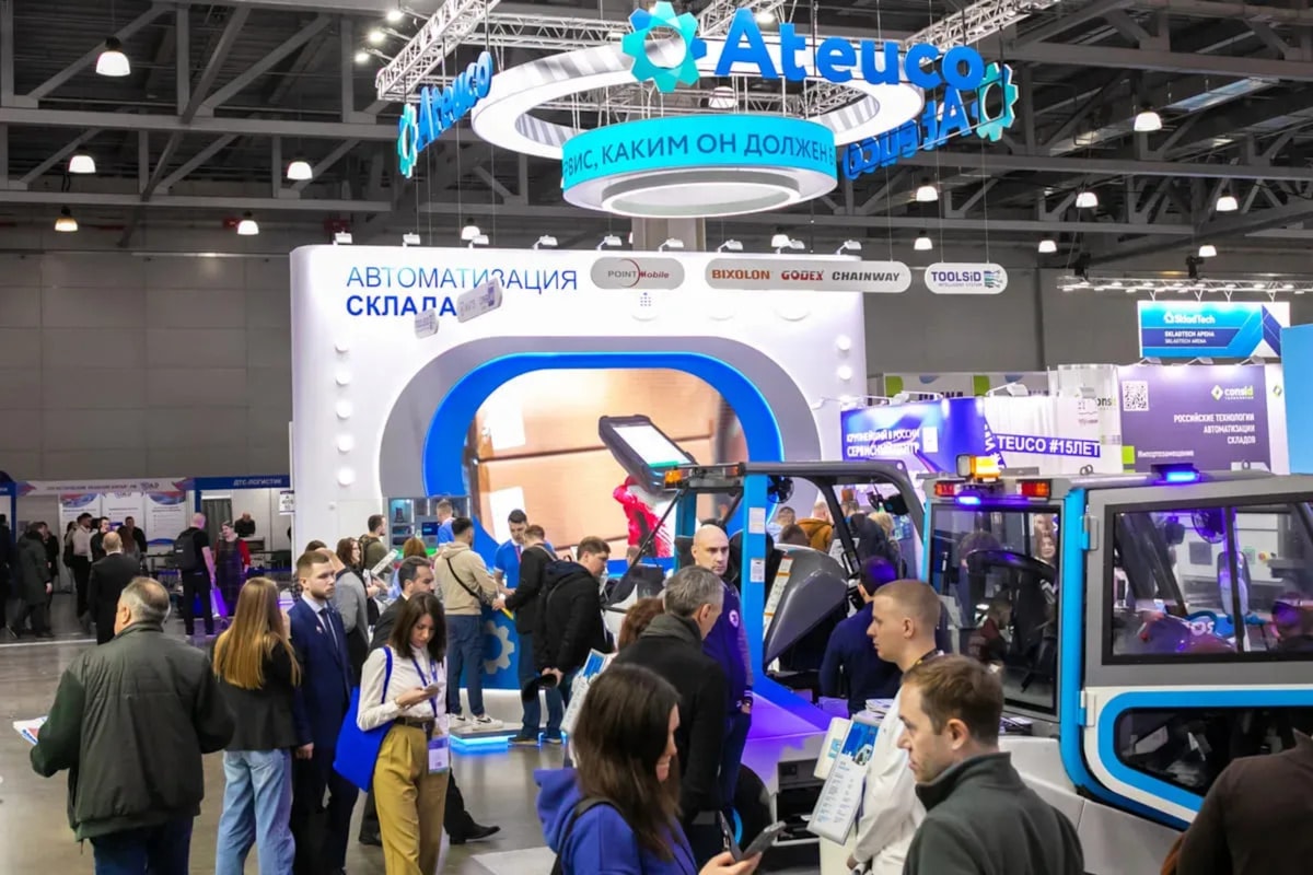Attendees browsing booths on a trade-show floor